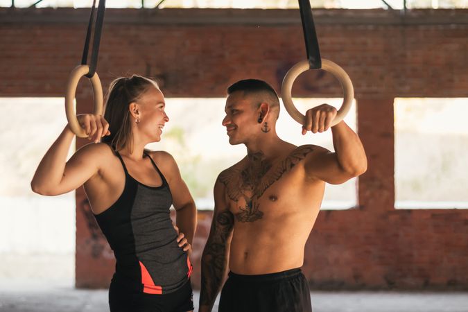 couple training with gymnastic rings