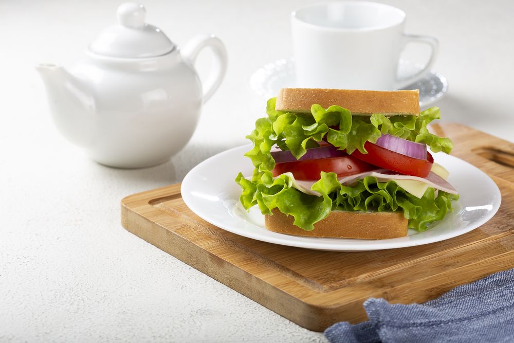 Natural sandwich. Sandwich with cheese, ham, lettuce, tomato and red onion.