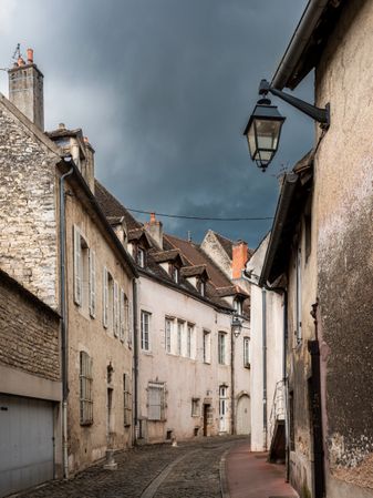 Empty streets of the medieval city of Beaune in Burgundy. The stormy sky
