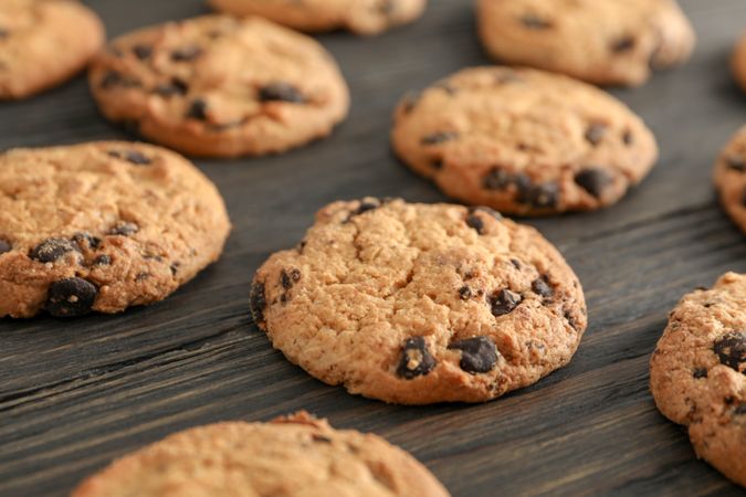 Chocolate chip cookies on wooden background