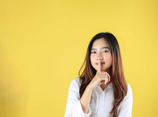 Young Woman Say Hush Be Quiet with Finger on Lips Shhh Gesture