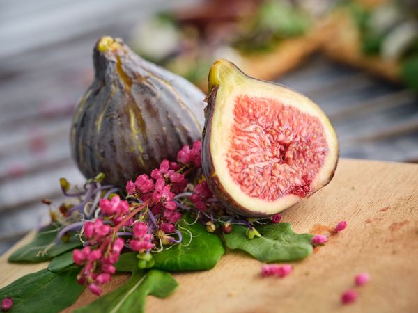 Fresh figs on wooden board