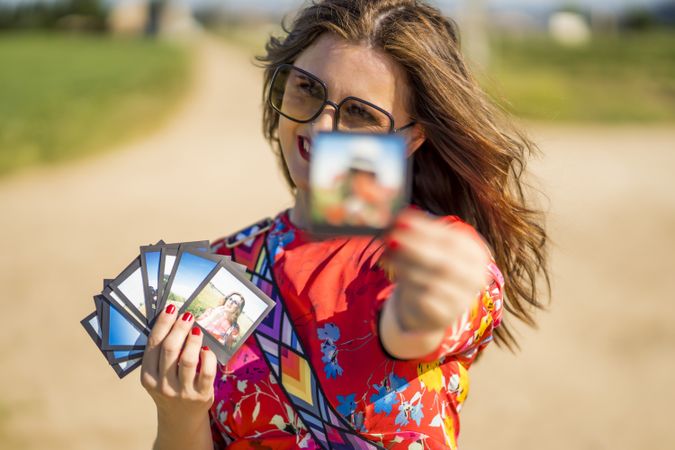 Young woman showing summer photos