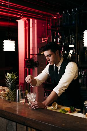 Barman working making drinks