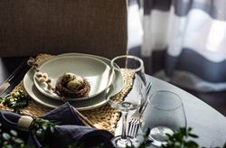 Spring table setting with decorative nest and branch on elegant table