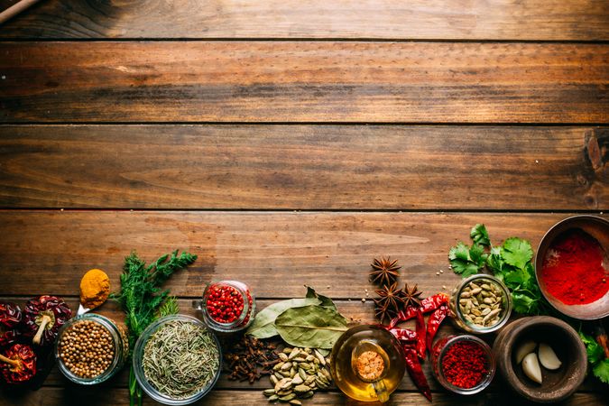 Spices and oil on table