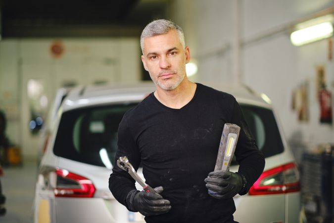 Male mechanic with tools in garage
