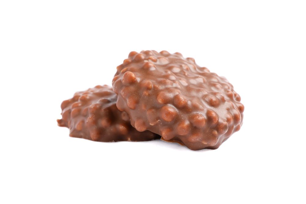 Chocolate cookies with caramel filling isolated on blank background