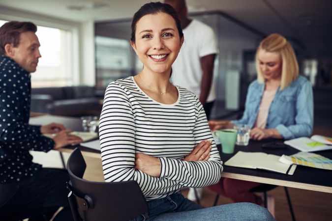 Portrait of smiling businesswoman in a casual office