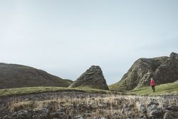 Woman walking along mountain
