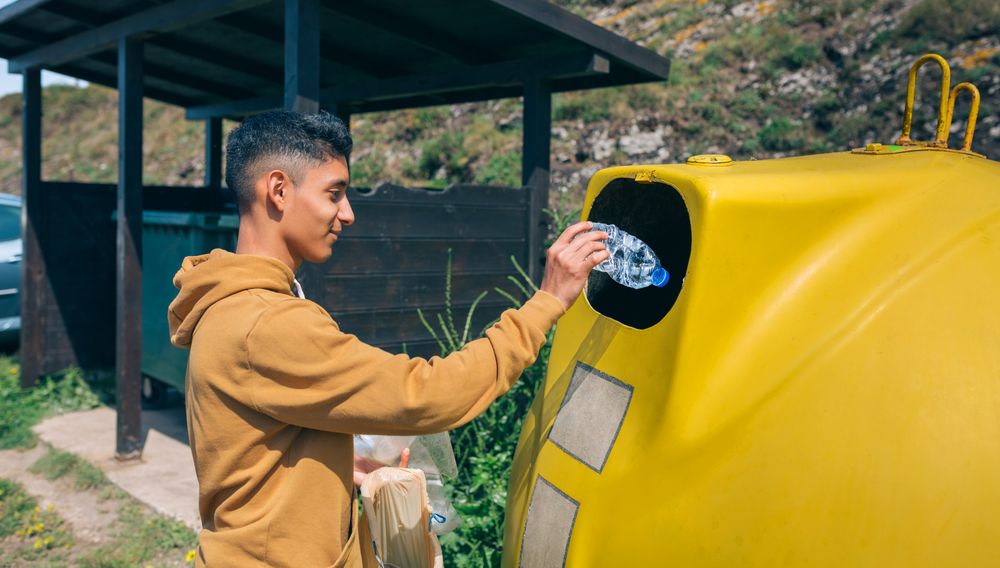 Man throwing garbage to container
