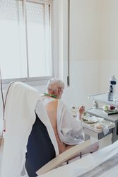 Older man admitted to a hospital room.