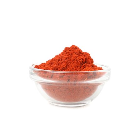 Side view of bowl of a dark red spice