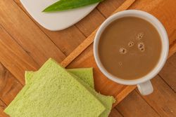 Soft pandan flavored bread and milk coffee