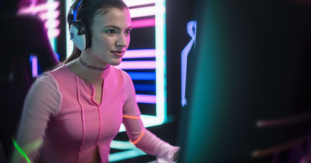 Young Female Gamer Playing Online Video Game on a Computer in a Cyberpunk Digital Neon World.