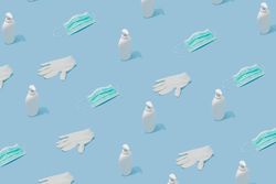 Pattern made with hand sanitizer, face mask and latex gloves