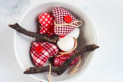 St. Valentines Day concept with bowl of felt heart decorations