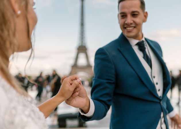 Happy newlyweds in wedding clothing dancing together