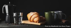 Banner with croissants on wooden breadboard, with space for text 56pjVb