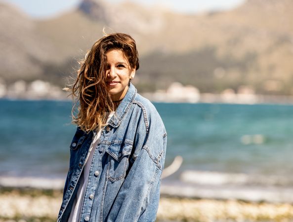 Young woman walking on seashore