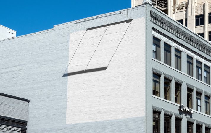 Painted square on side of blue brick building for mockup