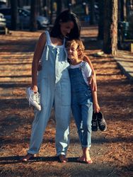 Barefoot mother and son bonding while walking