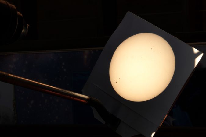 Projected image Sun showing sunspots through telescope.