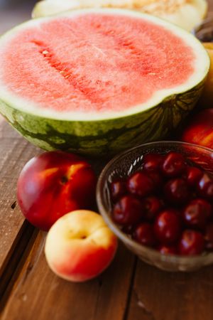 Delicious summer fruits on wooden table