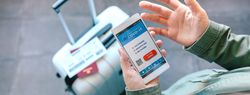 Hands holding a mobile with denied covid passport