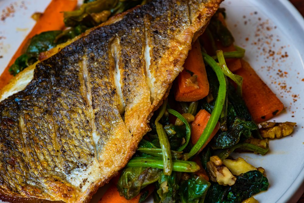 Top view of grilled salmon fish and vegetable