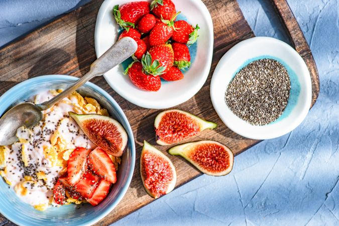 Top view of traditionally healthy breakfast with chia, figs and strawberry