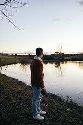 Photographer watching the sunset on a lake