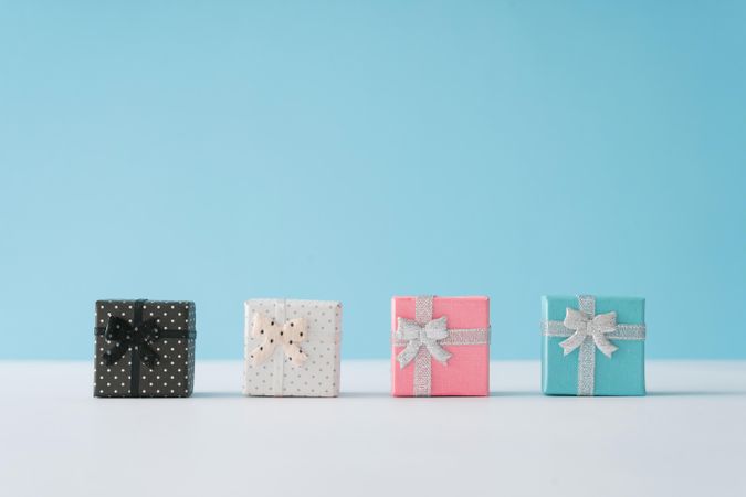Gift boxes on pastel blue background.