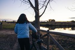 Woman with a bike in the countryside
