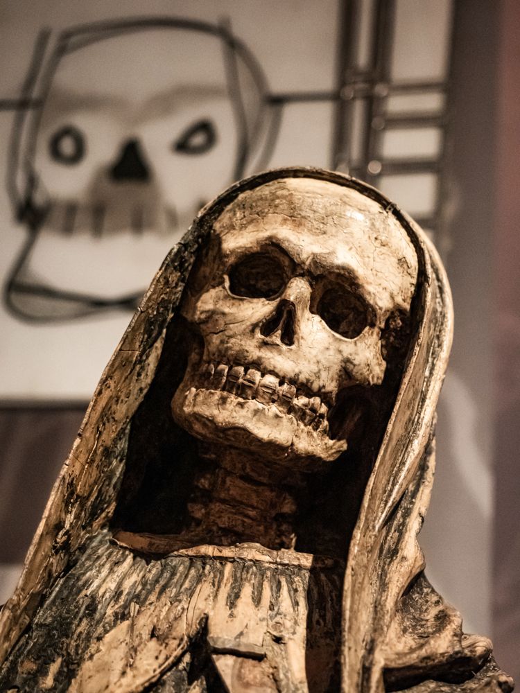 Depiction of death in ancient art. Skeleton statue.