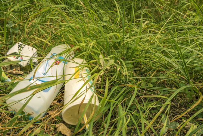 Heap of garbage on the green grass