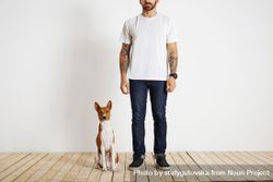 Man and dog standing in empty room 41N9lb