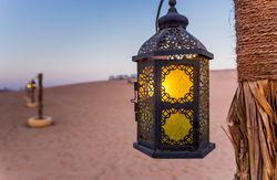 Poles with lanterns in desert