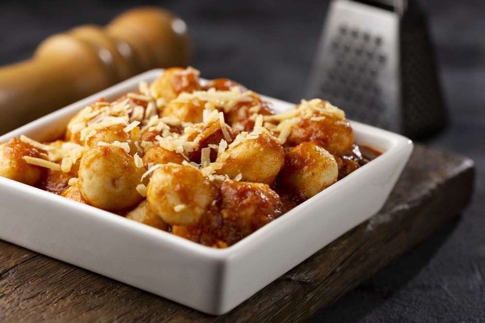 Gnocchi with tomato sauce and grated Parmesan cheese.