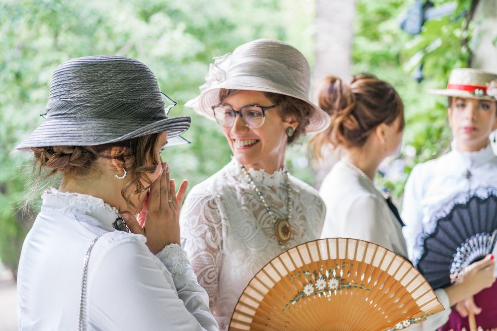 Vintage female friends speaking in garden