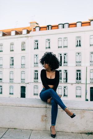 Fashionable female relaxing in city
