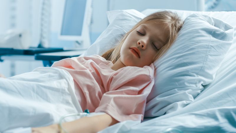 Cute Little Sick Girl Sleeps on a Bed in the Children's Hospital