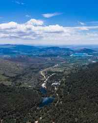 Landscape of blue lakes surrounded by greenery and rocks