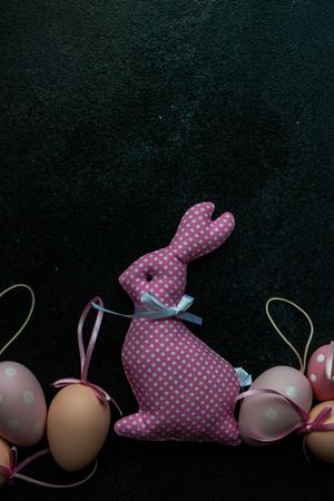 Easter holiday card concept with pink rabbit decoration and egg decor