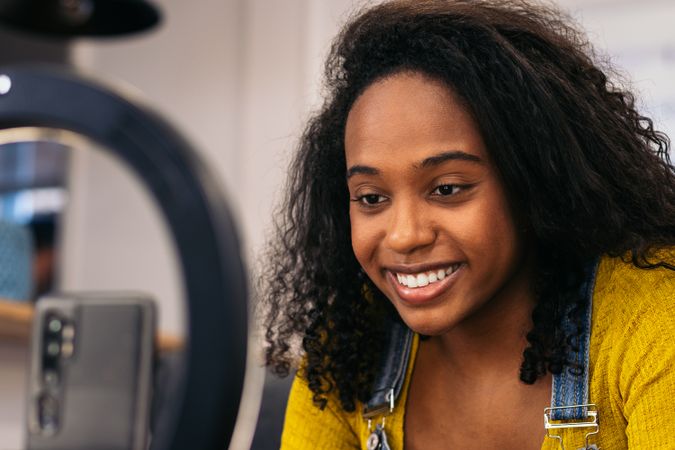 Young woman creates content with phone