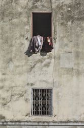 Cloths hanging and drying from window