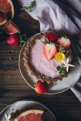 Strawberry and citrus cake served on wooden table