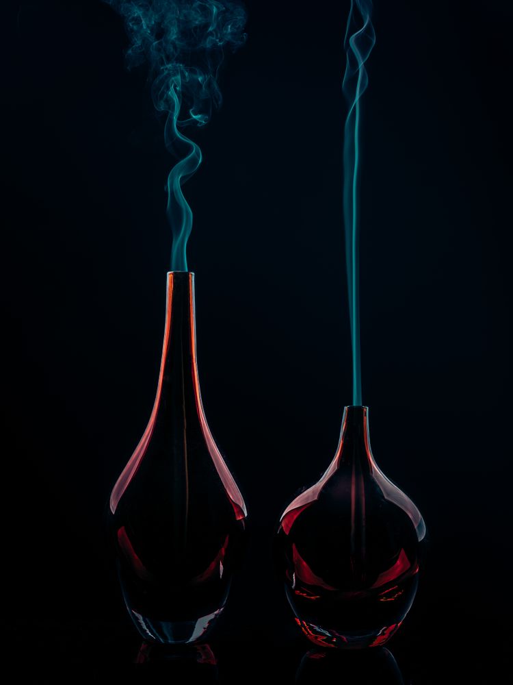 Glass bottles emitting smoke