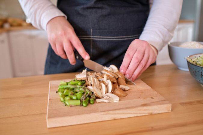Crop chef cooking healthy lunch at home