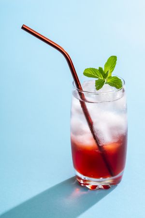 Summer drink with strawberry syrup and mineral water